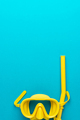 Yellow Diving Mask and Snorkel Over Blue Background with Copy Space - PhotoDune Item for Sale