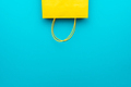 Flat Lay Photo of Upturned Yellow Bag on The Blue Background with Copy Space - PhotoDune Item for Sale