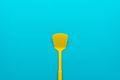 Minimalist Photo of Yellow Spatula on Turquoise Blue Background with Copy Space - PhotoDune Item for Sale
