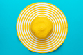 Top View of Yellow Hat on Blue Background - PhotoDune Item for Sale