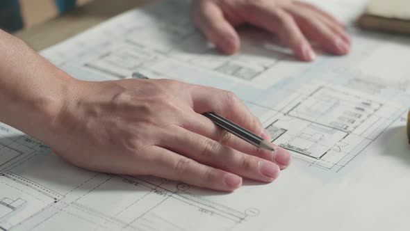 Close Up Of Hand's Man Engineer Drawing Blueprint