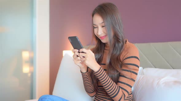 Young asian woman use smart phone