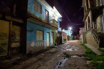borhood in a small Cuban Town during night time.