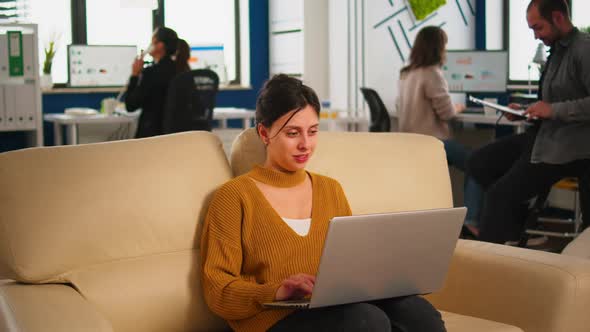 Happy Business Woman Reading Good News on Laptop Smiling