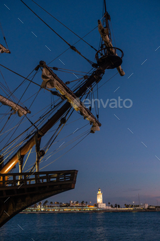 agaport of the city of Malaga and in the background La Farola de Malaga, Andalusia. Spain