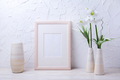 Wooden frame mockup with lily and striped vase - PhotoDune Item for Sale