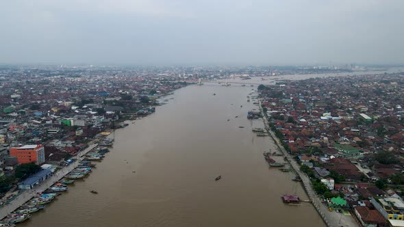 Endless city of Palembang and vast river of Musi, high angle drone view