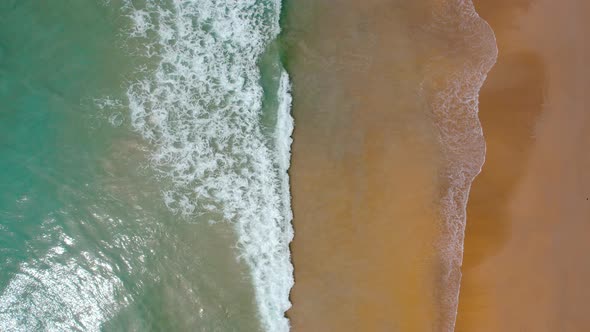 Drone View of Beautiful Seamless Never Ending Footage While Turquiose Sea Waves Breaking on Sandy