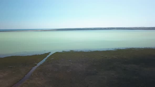 Aerial View of Big Lake and Forest in Calm Spring Day in Cyprus