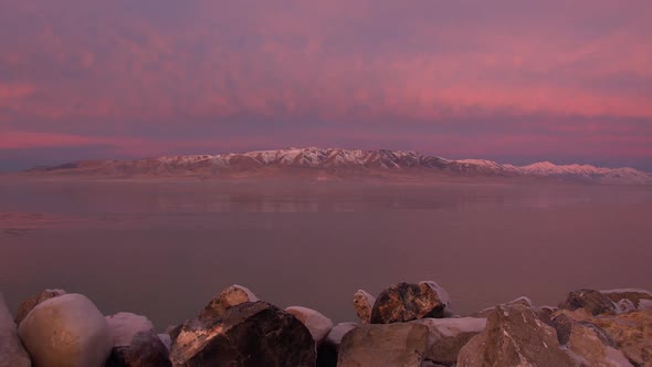 Time lapse over Utah Lake at sunrise with pink clouds