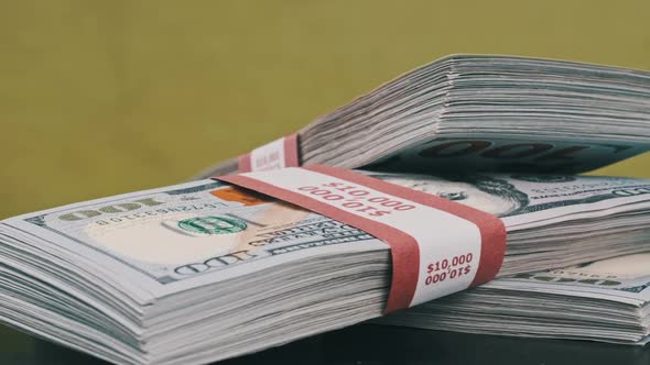 Dollars Bundles Rotate on Green Background Heap of Money