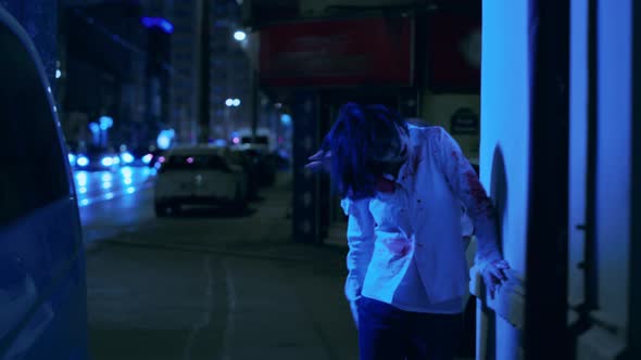 Creepy Looking Office Zombies Wandering on Sidewalks of City at Night