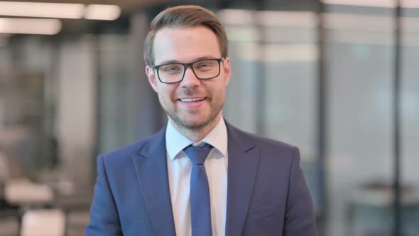 Portrait of Businessman Talking on Online Video Call