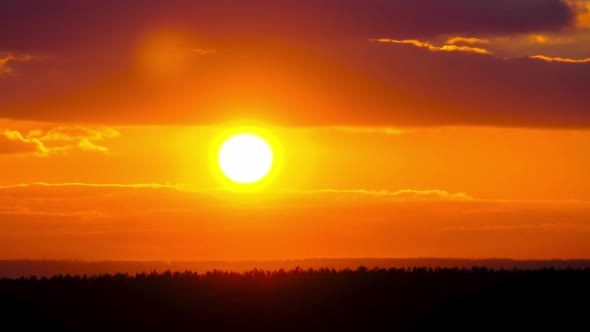 Timelapse Sunset in the Sky Big Bright Yellow Sun Moves Down on the Horizon