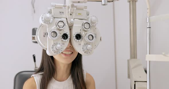 Woman Is Visiting Oculist in Clinic