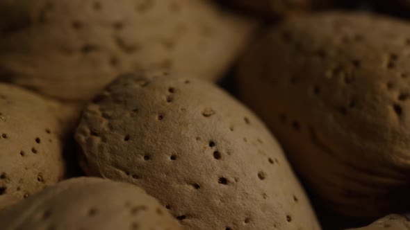 Cinematic, rotating shot of almonds on a white surface - ALMONDS