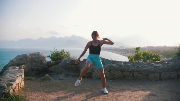 Young Woman Doing Fitness Exercises Outdoors