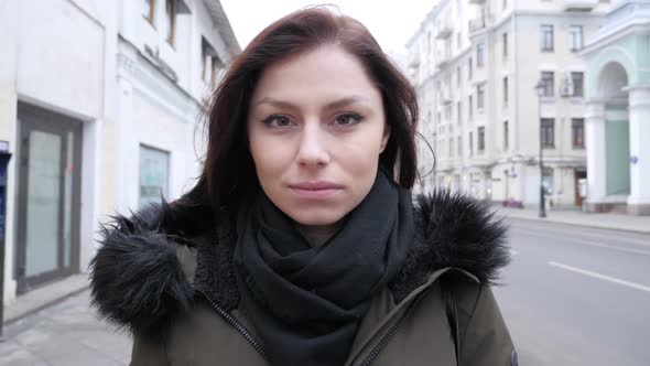 Portrait of Young Woman Standing on Street