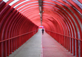 Man Walking Alone In A Covered Walkway - PhotoDune Item for Sale