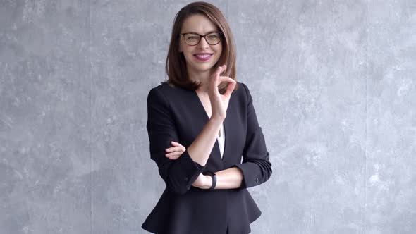 Portrait of Happy Young Business Woman Isolated on Gray Background