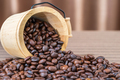 Wood cask with roasted coffee beans heap-2 - PhotoDune Item for Sale