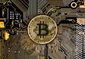 Bitcoin coins on black circuit board - PhotoDune Item for Sale