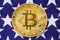 Gold Bitcoin coin on usa flag background - PhotoDune Item for Sale