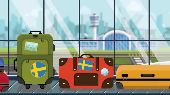 Suitcases with Sweden Flag Stickers on Baggage Carousel