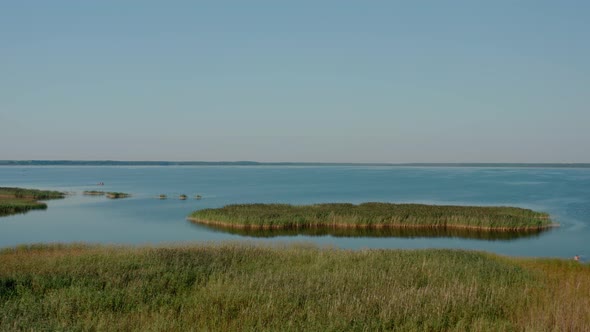 Aerial Drone View of Flight Over the Lake on the Morning