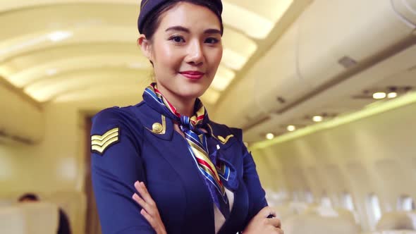 Cabin Crew or Air Hostess Working in Airplane