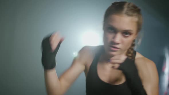 Slow Motion Female Fighter Trains His Punches and Defense Training in the Boxing Gym Woman Power