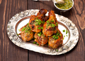 Fried chicken drumsticks with spicy sauce and herbs - PhotoDune Item for Sale