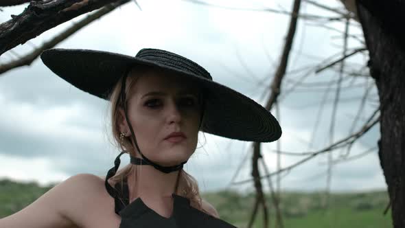 Portrait Of Pretty Blonde In Black Hat.