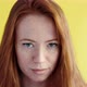 Close-up portrait of beautiful young happy red-haired woman on yellow background - VideoHive Item for Sale