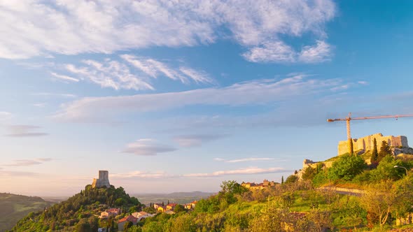 Time lapse at sunset: Rocca d'Orcia, a medieval village and fortress in Orcia Valley, Tuscany, Italy