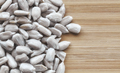 Close up picture of hulled sunflower seed kernels on a wooden background - PhotoDune Item for Sale