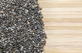Close up picture of chia seeds on a wooden background. - PhotoDune Item for Sale
