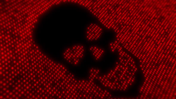 Computer virus code on a screen with a skull malware attack