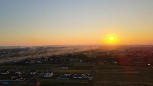 Aerial View of Residential Houses in Suburban Rural Area at Sunset