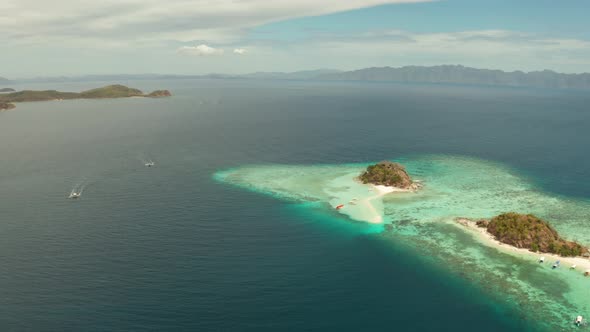 Small Torpic Island with a White Sandy Beach Top View