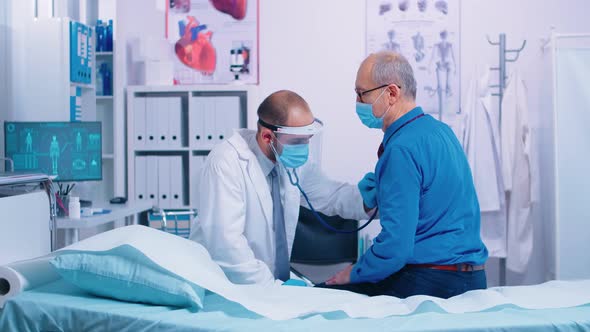 Doctor Listening Heart of Senior Patient