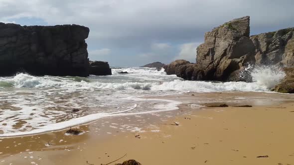 Waves on the beach with big rocks in Quiberon, Brittany France