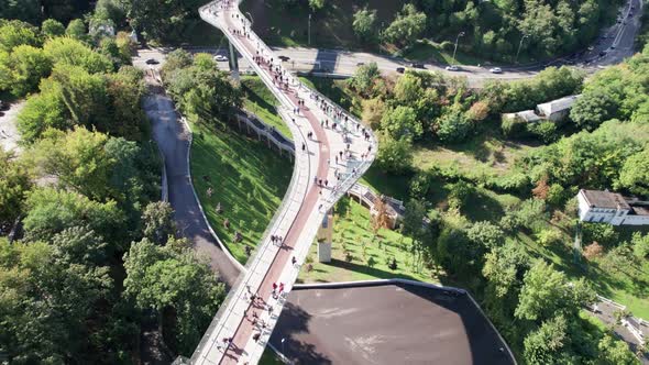 Aerial Top View of Pedestrian Glass Bridge with a Crowd of Walking People