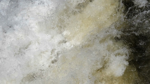 Foaming Effervescent Water Surface of Mountain River.