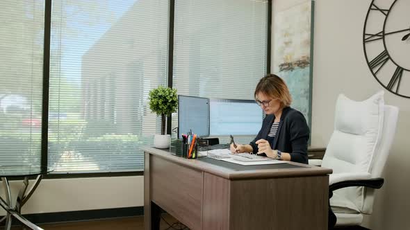 Woman Sit at Desk Using Computer Make Data Analysis Check Statistics Research Workday in Office