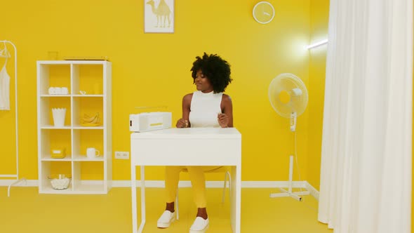 Stylish African Woman Is Listening Music On Retro Recorder