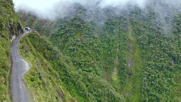 Drone Flying over the Bus with Tourists on Road of Death in Mountains of Bolivia