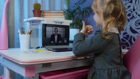 Cute Kid Pupil Watching Video Lesson Studying Using Digital Laptop Computer Doing Homework Online