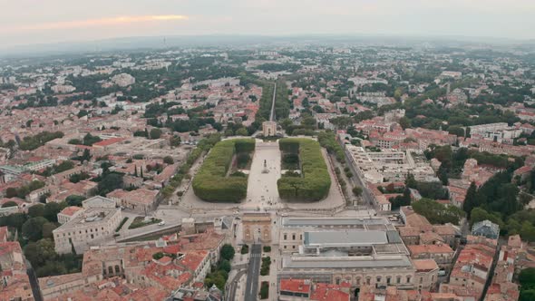 Dolly forward drone shot of Montpellier arc de triomphe