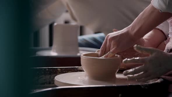 Adult Sculptor Making Ceramics in Workshop Studio